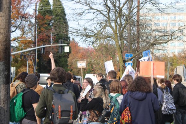 A group of students protesting in front of Benson.